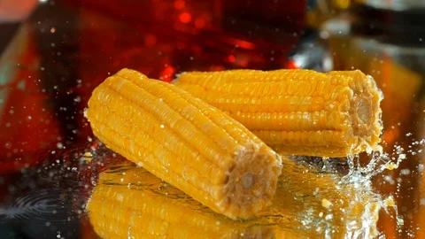 Corn fall into the water table. Slow motion, 4k , phantom .close-up Stock Footage 114972883