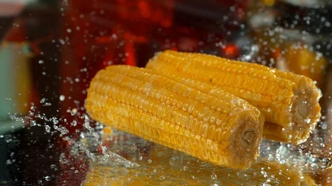 Corn fall into the water table. Slow motion, 4k , phantom .close-up Stock Footage 114972922