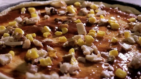 Corn falls on the pizza surface Stock Footage 101201854