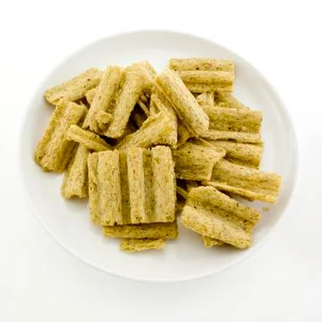 Corn flake cereal in a pile isolated against a white background Stock Photos
