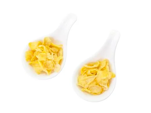 Corn flake in spoon on top view Stock Photos