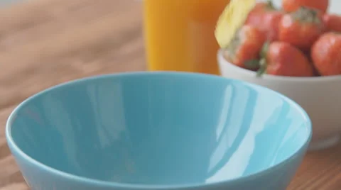 Corn flakes and milk falling in a bowl, slow motion Stock Footage 68951293