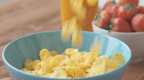 Corn flakes and milk falling in a bowl, slow motion Stock Footage 68951430