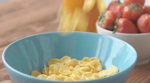 Corn flakes and milk falling in a bowl, slow motion Stock Footage 68951559