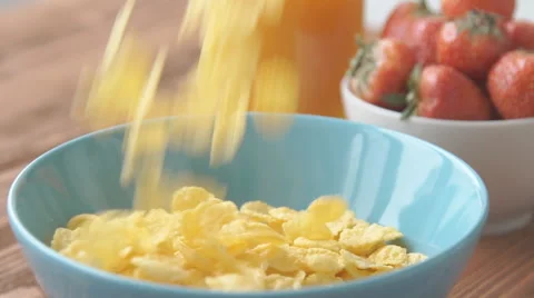Corn flakes and milk falling in a bowl, slow motion Stock Footage 68951718