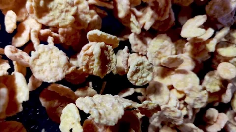 Corn flakes on black background Stock Footage 277635809