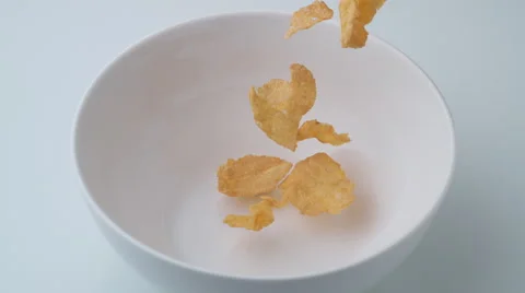 Corn flakes in a bowl. Slow Motion. Stock Footage 60965413
