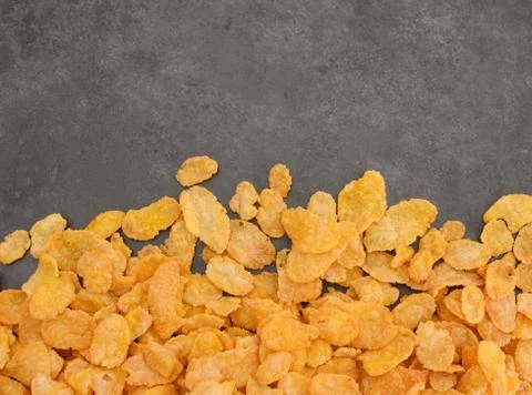 Corn flakes breakfast cereal line on a grey slate Stock Photos