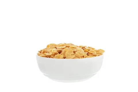 Corn flakes breakfast cereal in a white bowl over white background isolated Stock Photos