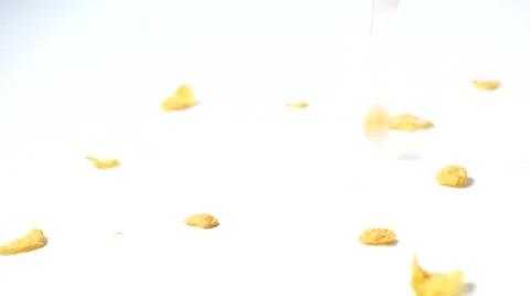 Corn flakes cereals dropping at table Stock Footage 58820812