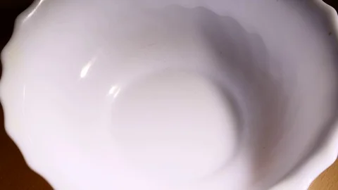 Corn flakes falling into bowl of corn flakes slowmo Stock Footage 84053188