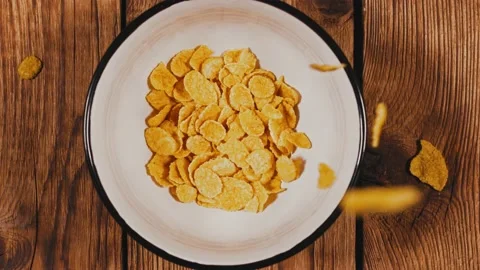 Corn Flakes Falling Into bowl Stock Footage 144616029