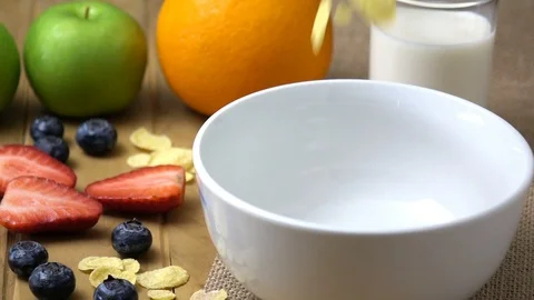 Corn flakes falling in to a bowl in slow motion. Stock Footage 94503789