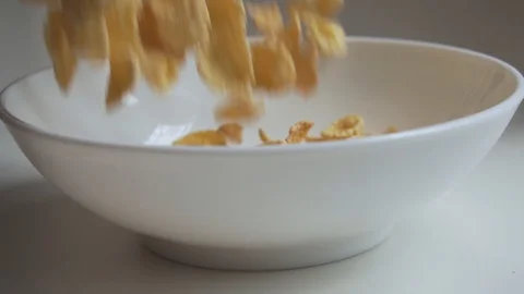 Corn flakes falling into the bowl in slow motion. Stock Footage 129234813