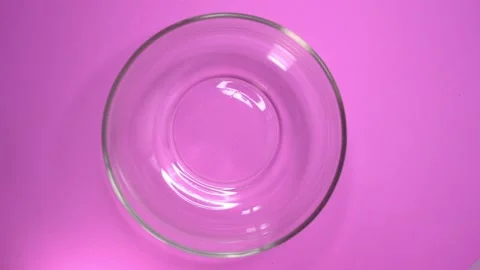 Corn flakes falling into the bowl in slow motion. 動画素材 131751926