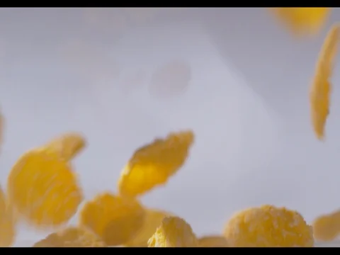 Corn flakes falling in a glass bowl, filling it up with many layers Stock Footage 74183235