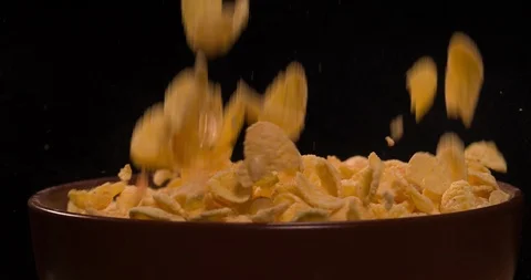 Corn Flakes falling pouring in bowl 4K video Stock Footage 108776623