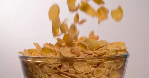 Corn Flakes falling pouring in bowl 4K video Stock Footage 108777316