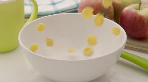 Corn flakes falling in white bowl Stock Footage 55031536