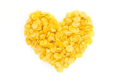 Corn Flakes in the form Heart Isolated Top View on White Background Stock Photos