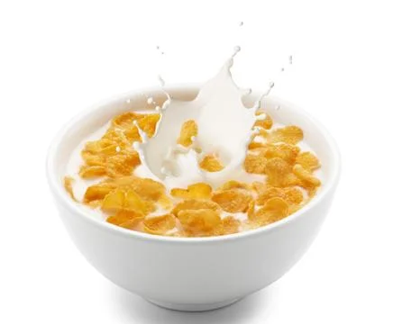 Corn flakes with milk splash Stock Photos