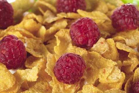 Corn flakes with raspberry Stock Photos