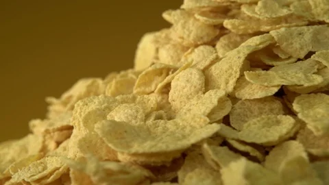 Corn flakes rotate in front of the camera. Video stock 126403349