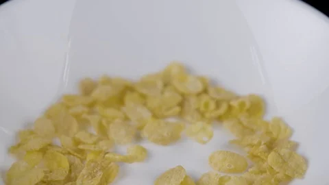 Corn flakes in a rotating bowl Stockbeeldmateriaal 94326843