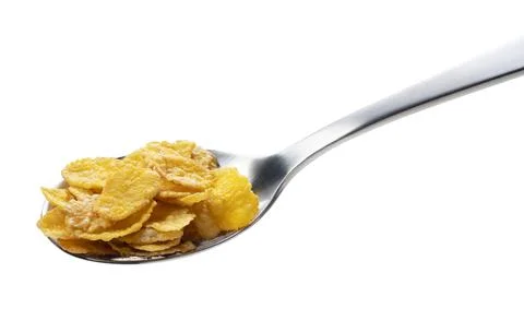 Corn flakes on the spoon isolated on white Stock Photos
