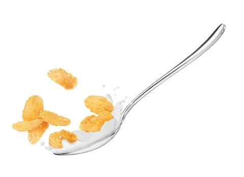 Corn flakes in a spoon with milk close-up, isolated on white background Stock Photos