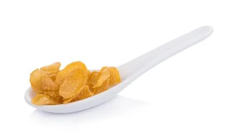 Corn flakes in spoon on white background 写真素材