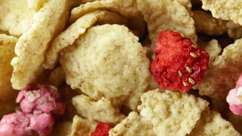 Corn flakes with strawberry in a bowl without milk rotation. 4K. macro close up Stock Footage 154739668