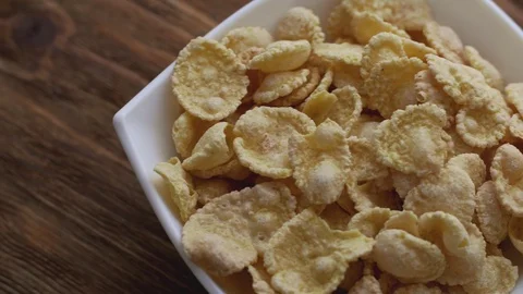 Corn flakes in white bowl. Slide right Video stock 104873091