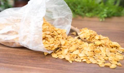 Corn flakes on wood table Stock Photos