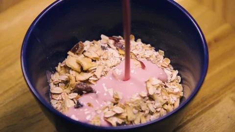 Corn flakes with Yogurt pouring, healthy food breakfast, super slow motion shot. Stock Footage 128554367