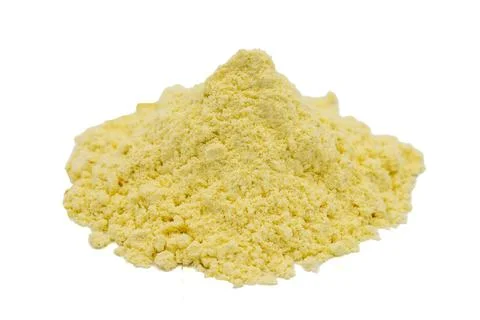 Corn flour isolated on white background. Pile of cornmeal. close up Stock Photos