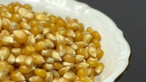Corn grains in a bowl. Sweet maize, cereal grains. Rotation. Grey background. Stock Footage 101478459
