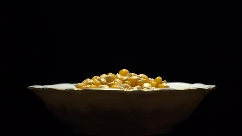 Corn grains in a bowl. Sweet maize, cereal grains. Rotation. Black background. Stock Footage 101478906