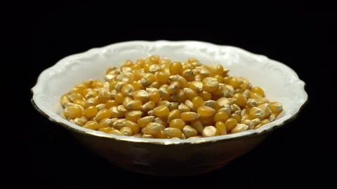 Corn grains in a bowl. Sweet maize, cereal grains. Rotation. Black background. Stock Footage 101479232