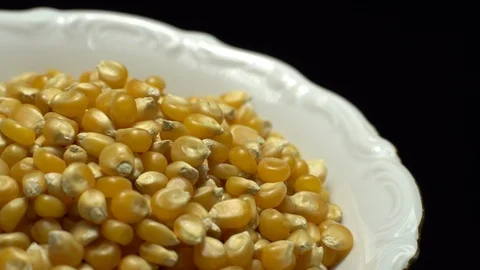 Corn grains in a bowl. Sweet maize, cereal grains. Rotation. Black background. Stock Footage 101479435