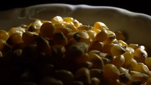 Corn grains in a bowl. Sweet maize, cereal grains. Rotation. Black background. Stock Footage 101479569
