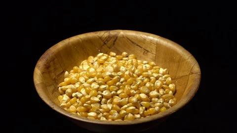 Corn grains in a bowl. Sweet maize, cereal grains. Rotation. Black background. Stock Footage 101484802