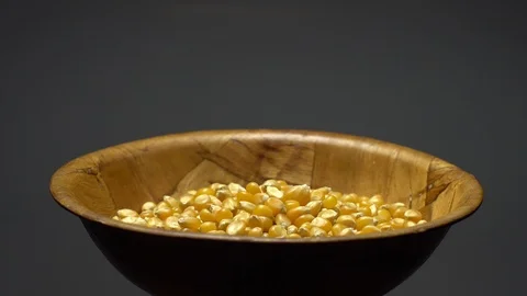 Corn grains in a bowl. Sweet maize, cereal grains. Rotation. Grey background. Stock Footage 101485094