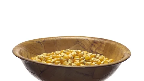 Corn grains in a bowl. Sweet maize, cereal grains. Rotation. Isolated on white. Stock Footage 101485260
