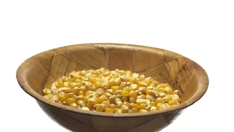 Corn grains in a bowl. Sweet maize, cereal grains. Rotation. Isolated on white. Stock Footage 101485387