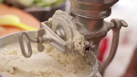 Corn grinding process for the preparation of the humitas Stock Footage 221214467