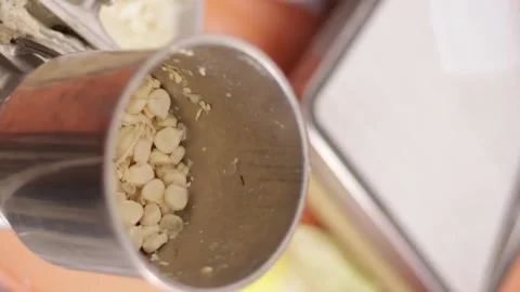 Corn grinding process for the preparation of the humitas of the Pachamanca Stock Footage 221216402