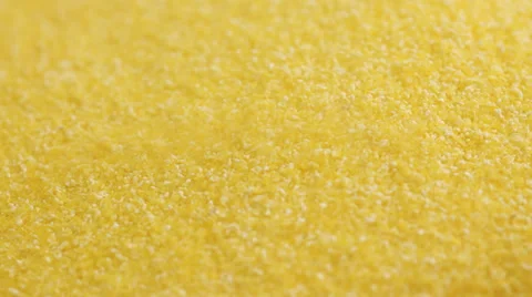 Corn Grits - corn flour poured into bowl; close up; Stock Footage 35924615