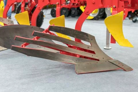 Corn harvester head with several silver blades. Agricultural machinery for so Stock Photos
