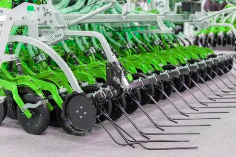 Corn harvester head with several silver blades. Agricultural machinery for so Stock Photos